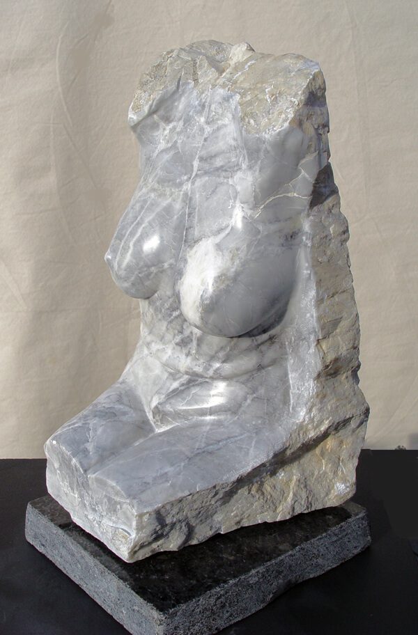 A sculpture of a woman 's bust in rock