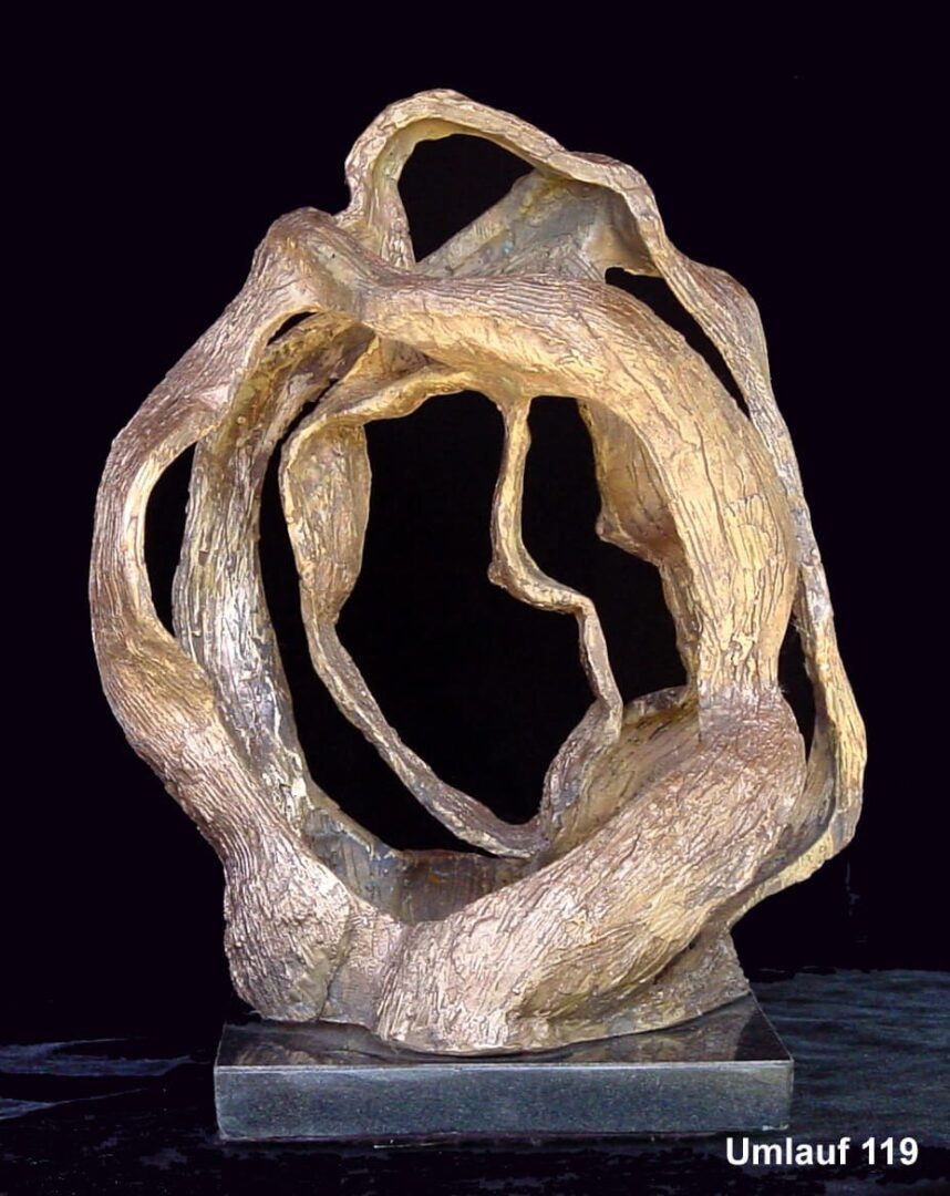 A sculpture of a tree branch in the middle of it.