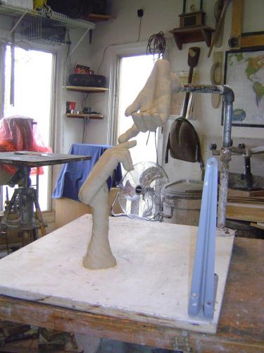 A sculpture is being made in the studio.
