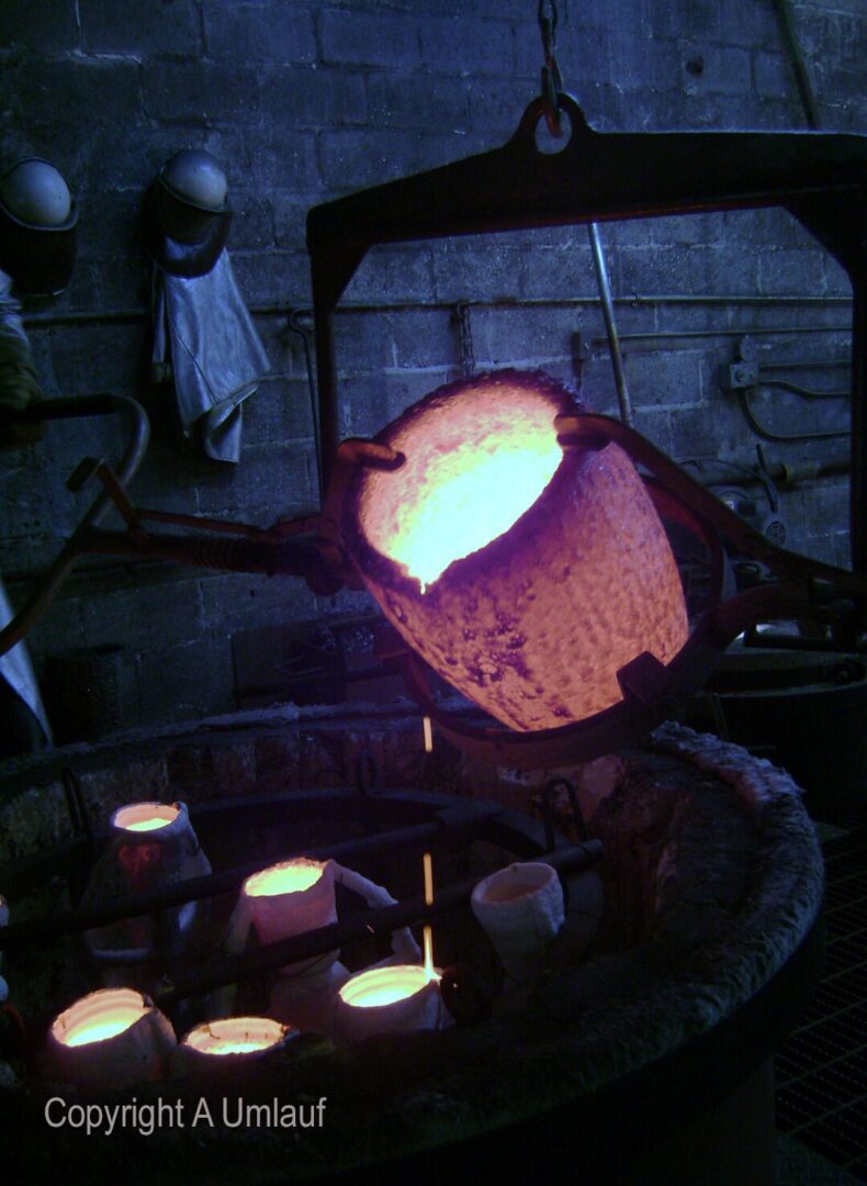 Ceramic shell mold process involves pouring a pot into a furnace.