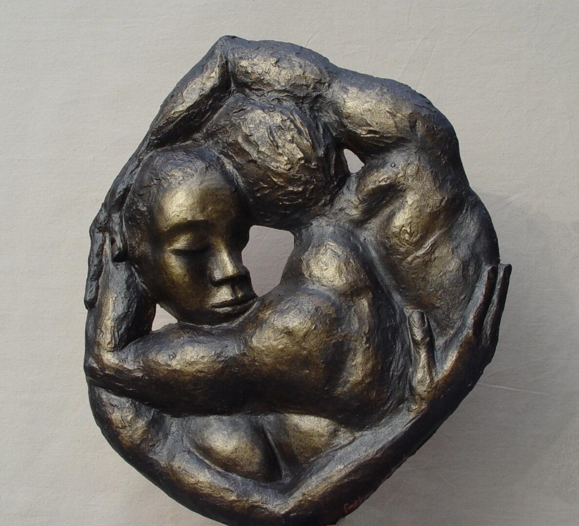 An Umlauf sculpture portraying two people in a heartfelt embrace.