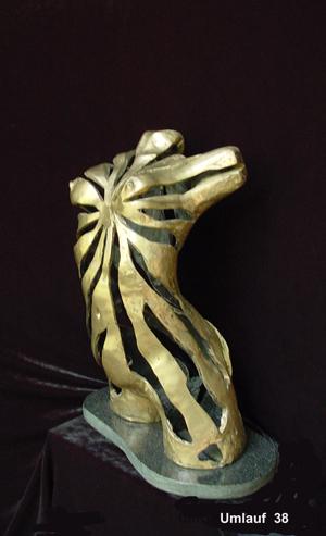 A bronze sculpture of a giraffe displayed in a Fine Art Gallery.