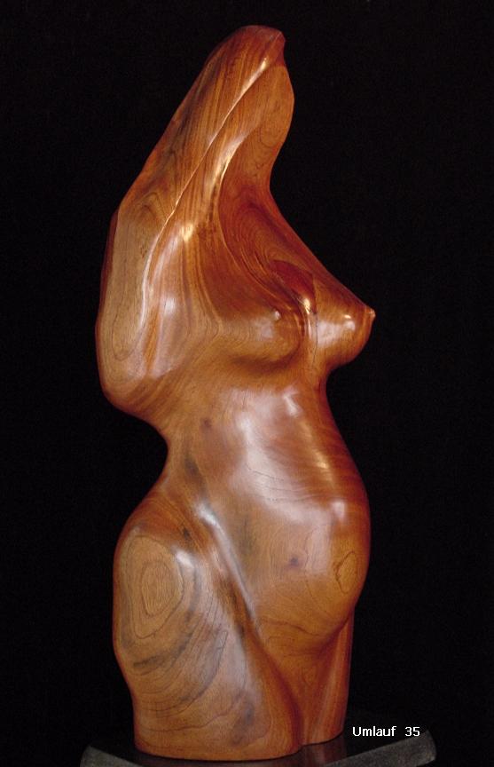 A pregnant woman sculpture.