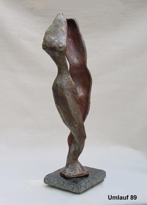 A bronze sculpture of a woman on a pedestal displayed in the Sculpture Collection.